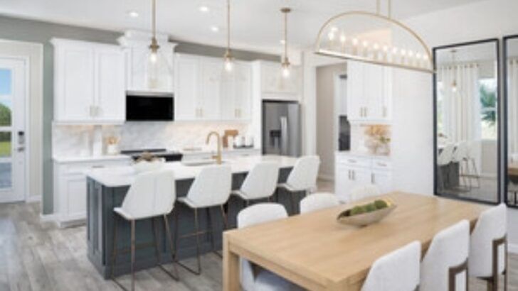 Interior rendering of a South Tampa townhome kitchen with white cabinetry, center island and modern finishes.