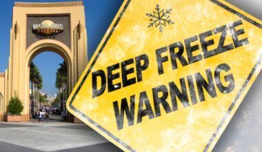 A Deep Freeze Warning alert appears above the iconic entrance of Universal Studios Florida, hinting at chilly thrills inside the park. Central Florida theme park closures due to extreme cold