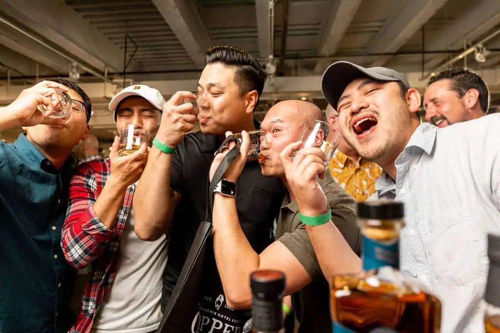 People at a whiskey tasting festival