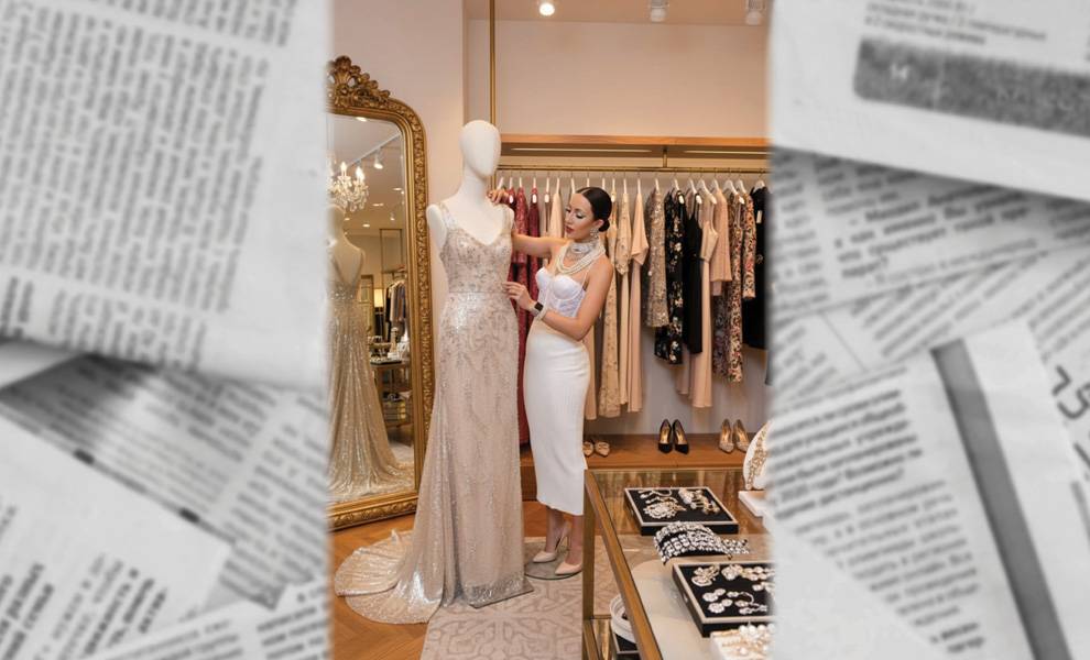 Choose to be all of who You are 2 Yli Liriano standing in front of a mannequin adjusting a gown.