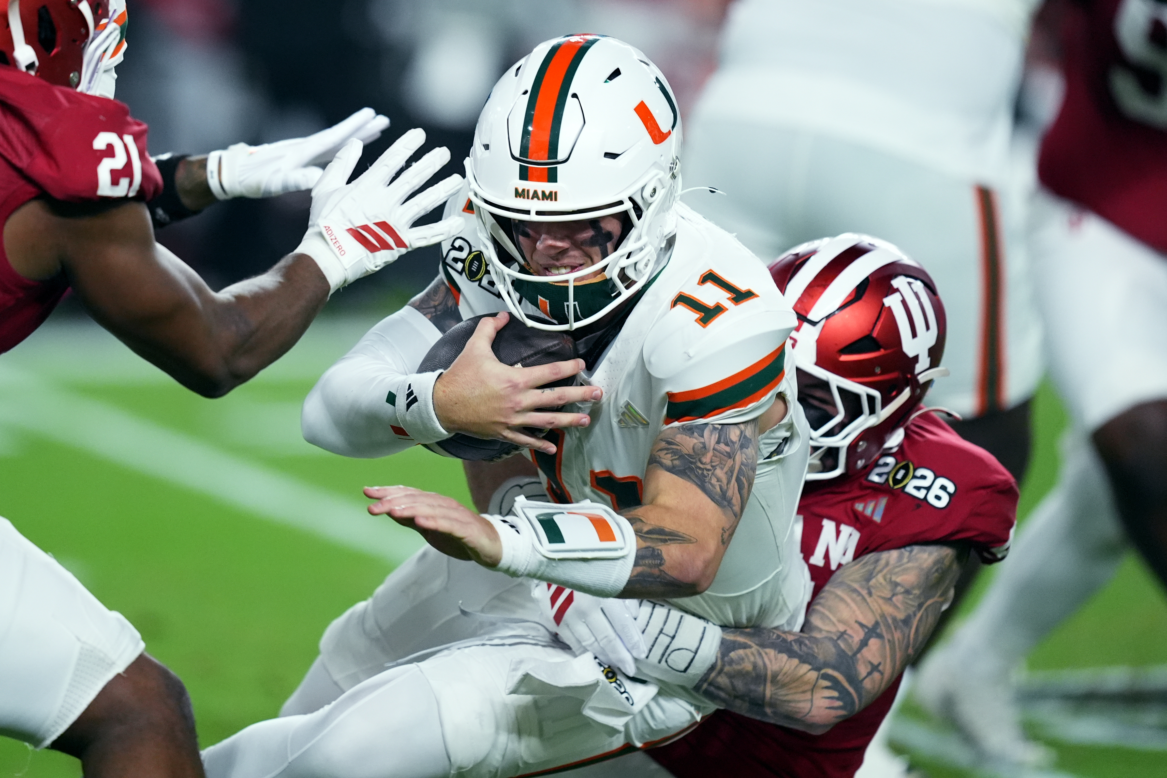 Miami quarterback Carson Beck is sacked by Indiana linebacker Aiden Fisher during the first half of the College Football Playoff national championship game, Monday, Jan. 19, 2026, in Miami Gardens, Fla. (AP Photo/Rebecca Blackwell)