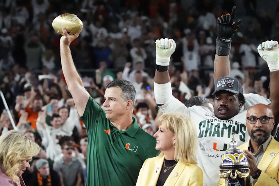 Miami Hurricanes head coach Mario Cristobal lifts the trophy after defeating Ole Miss 31-27 in the Vrbo Fiesta Bowl and CFP semifinal game at State Farm Stadium on Jan. 8, 2026, in Glendale.© Rob Schumacher&sol;The Republic &sol; USA TODAY NETWORK via Imagn Images&period;