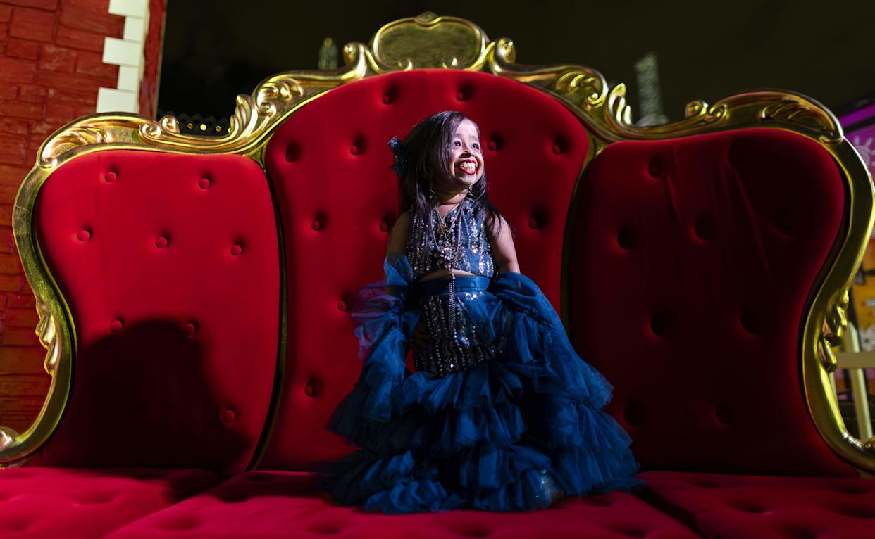 Jyoti Amge, an Indian actress and Guinness World Record holder for being the world's shortest living woman, is photographed during the grand opening of Ripley's Believe It or Not! Christmas Park at Amelia Earhart Park on Thursday, Nov. 13, 2025, in Hialeah, Fla.