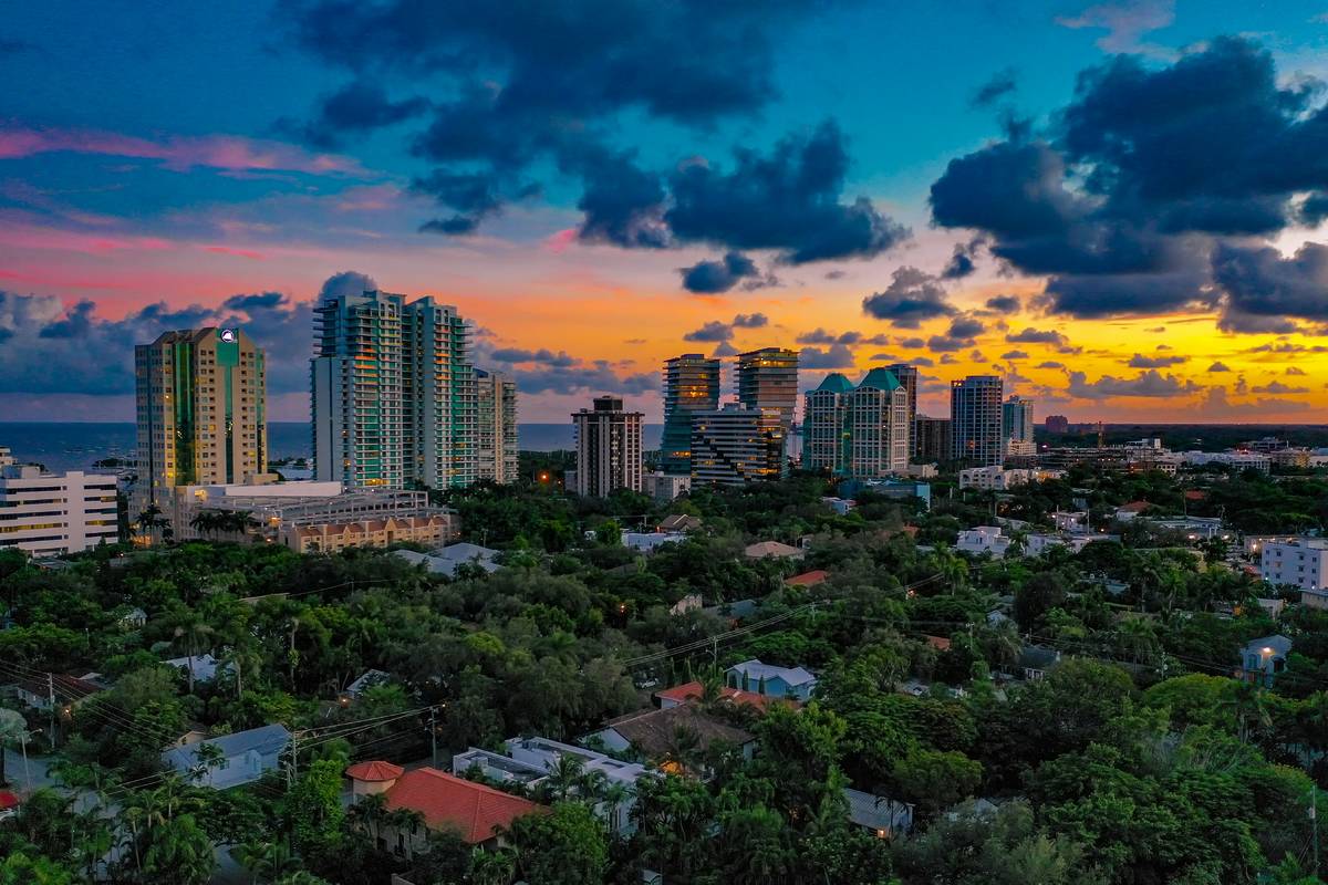 Aerial photo of high-rises and homes along the waterfront and marina at Coconut Grove, Miami, FL