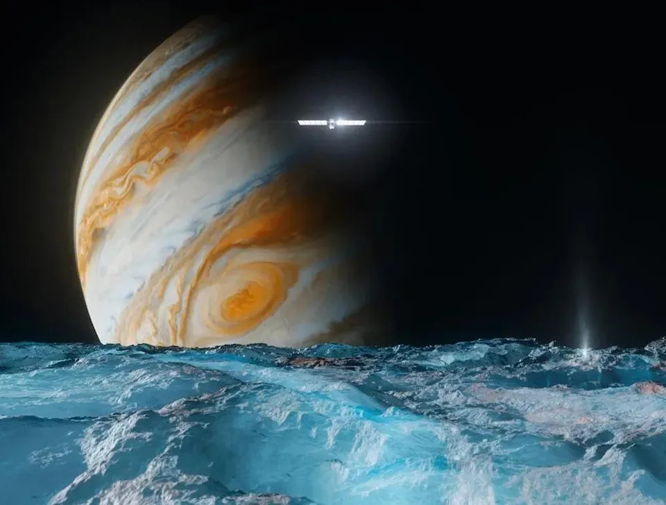 This artist’s concept depicts NASA’s Europa Clipper spacecraft as it orbits Jupiter and passes over the gas giant’s ice-covered moon Europa. Scheduled to arrive at Jupiter in April 2030, the mission will be the first to specifically target Europa for detailed science investigation.