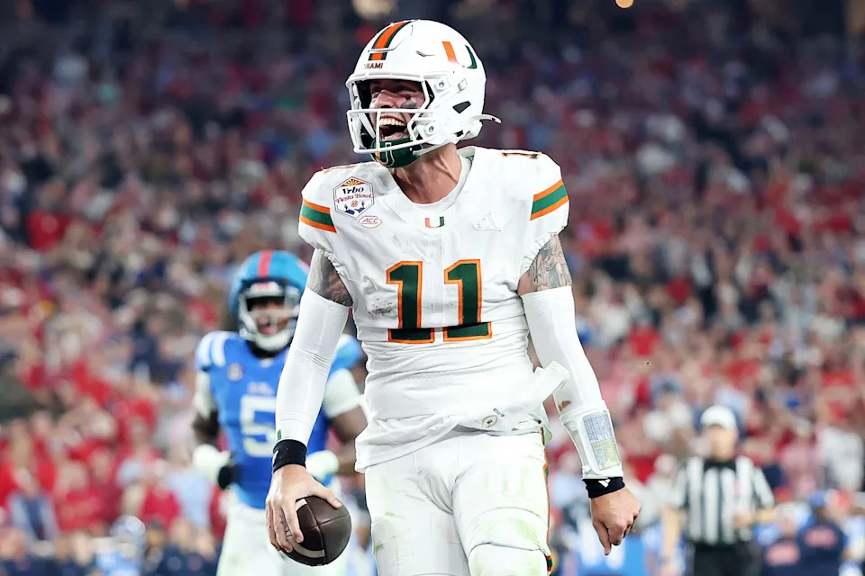 GLENDALE, ARIZONA - JANUARY 08: Carson Beck #11 of the Miami Hurricanes celebrates a touchdown against the Ole Miss Rebels in the fourth quarter during the 2025 College Football Playoff Semifinal at the VRBO Fiesta Bowl at State Farm Stadium on January 08, 2026 in Glendale, Arizona. The Hurricanes defeated the Rebels 31-27. (Photo by Christian Petersen/Getty Images)