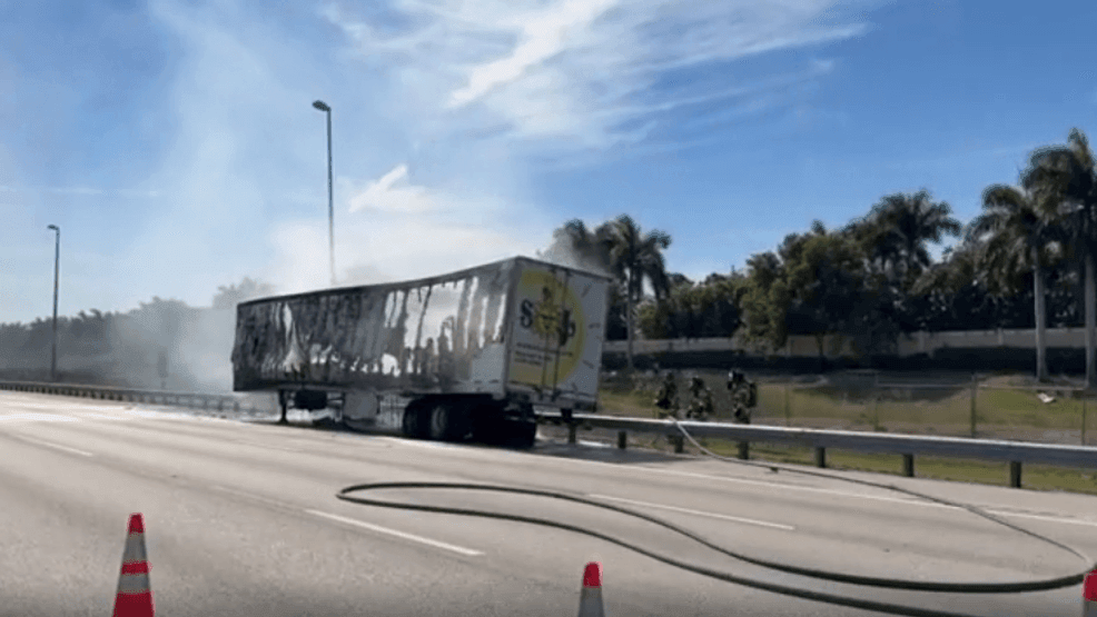 A vehicle fire on Florida’s Turnpike near Boynton Beach caused heavy delays Monday afternoon after two right southbound lanes were blocked just before Mile Marker 85. The incident, first reported around 1 p.m., involved a vehicle fully engulfed in flames on the shoulder as Palm Beach County Fire Rescue crews worked to extinguish the burning trailer. Traffic cameras captured smoke drifting across the roadway while drivers slowed to navigate the remaining open lanes, creating quickly building congestion. No injuries have been reported, and the cause of the fire remains under investigation. Officials issued an update minutes later warning motorists to expect delays and to consider alternate routes until the scene was fully cleared. (WPEC){ }