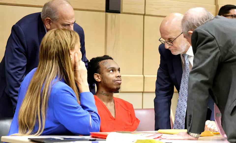 Jamell Demons, better known as rapper YNW Melly, listens to his attorneys during a hearing update at the Broward County Courthouse in Fort Lauderdale, Florida, on July 9, 2025.