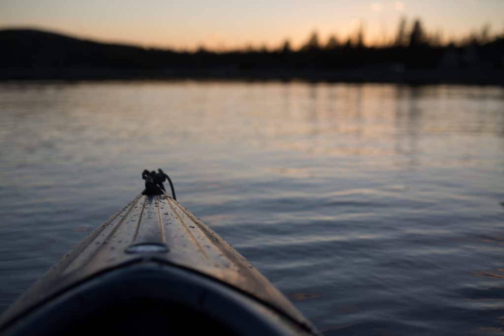 Riding a kayak at sunset