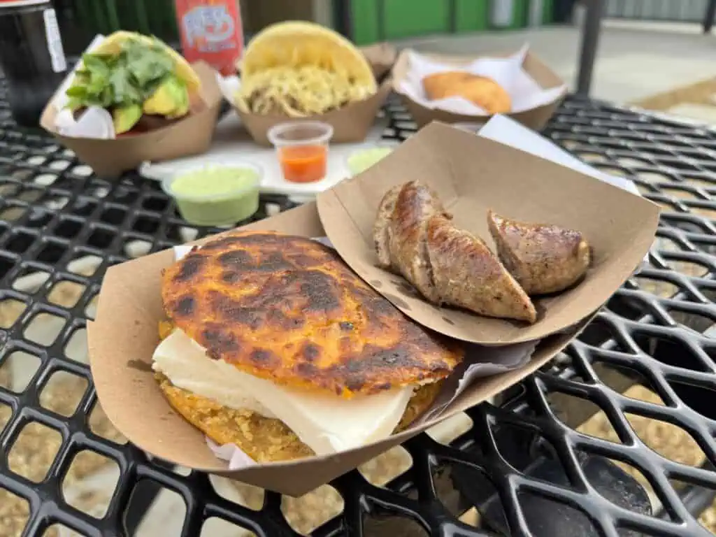 A plate of arepas and chorizo