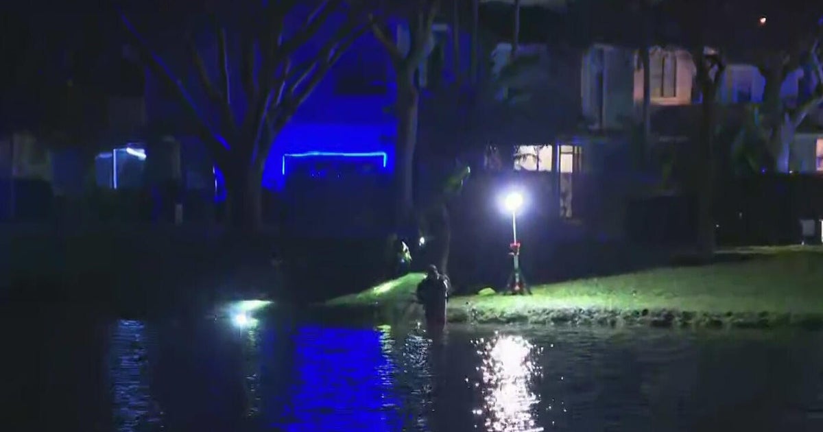 Broward Sheriff's Office dive team conducting investigation in Deerfield Beach lake