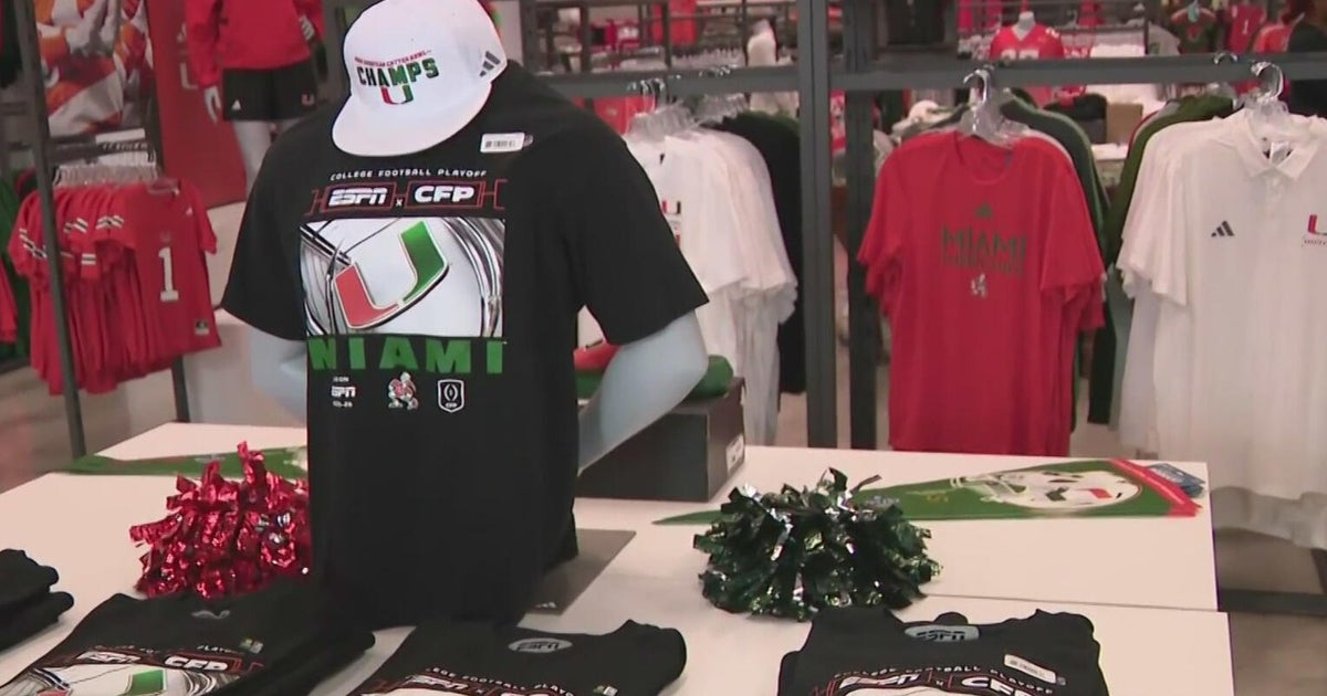 Fans at University of Miami team store grabbing merch ahead of tonight's Fiesta Bowl