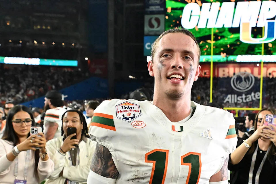 GLENDALE, ARIZONA - JANUARY 08: Carson Beck #11 of the Miami Hurricanes reacts after the game against the Ole Miss Rebels during the 2025 College Football Playoff Semifinal at the VRBO Fiesta Bowl at State Farm Stadium on January 08, 2026 in Glendale, Arizona. The Hurricanes defeated the Rebels 31-27. (Photo by Norm Hall/Getty Images)
