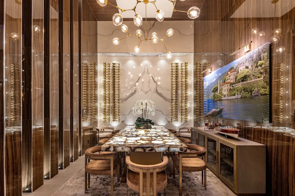 Dining room with tiger wood in celebrity developer Aldo Stars home in Florida