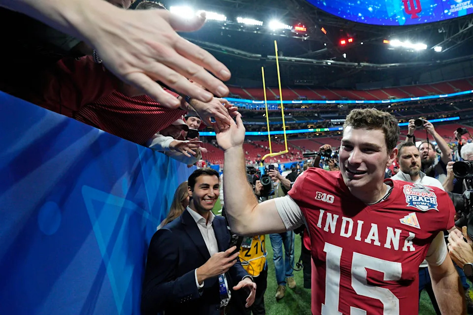 ATLANTA, GA - JANUARY 09: Indiana Hoosiers quarterback Fernando Mendoza (15) celebrates with fans after the College Football Playoff Semifinal at the Chick-fil-A Peach Bowl against the Oregon Ducks on January 09, 2026 at Mercedes-Benz Stadium in Atlanta, Georgia. (Photo by Joe Robbins/Icon Sportswire via Getty Images)