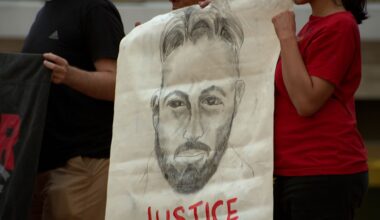 Demonstrators in Tampa hold a drawing of Alex Pretti, who was fatally shot by a federal immigration officer in Minneapolis. (Spectrum News)