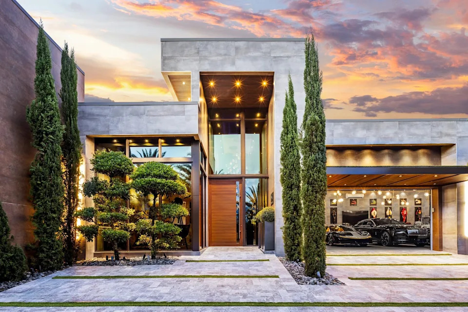 Entrance and garage in celebrity developer Aldo Stars home in Florida