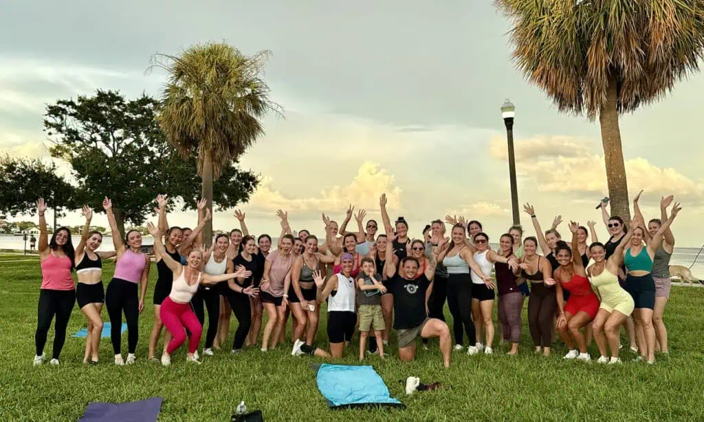 People posing as a group on the shore