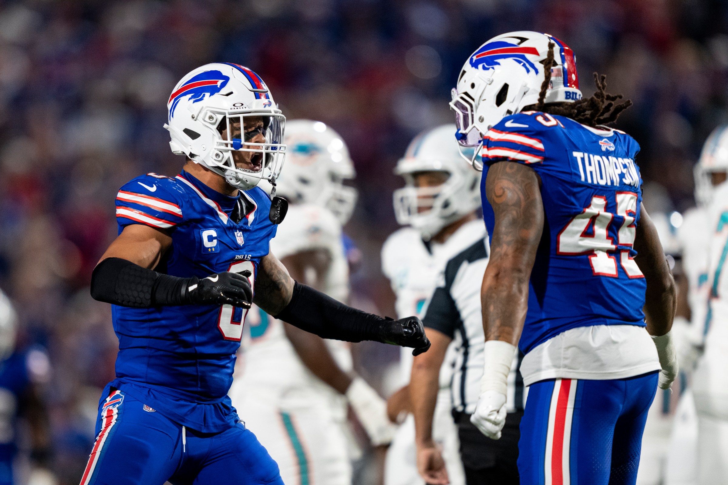 ORCHARD PARK, NEW YORK - SEPTEMBER 18: Terrel Bernard #8 of the Buffalo Bills reacts with his teammate Shaq Thompson #45 of the Buffalo Bills during an NFL football game against the Miami Dolphins at Highmark Stadium on September 18, 2025 in Orchard Park, New York. (Photo by Michael Owens/Getty Images)
