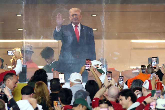College Football Playoff National Championship: Miami v Indiana MIAMI GARDENS, FLORIDA - JANUARY 19: U.S. President Donald Trump looks on prior to a game between the Miami Hurricanes and the Indiana Hoosiers in the 2026 College Football Playoff National Championship at Hard Rock Stadium on January 19, 2026 in Miami Gardens, Florida. (Photo by Patrick Smith/Getty Images)