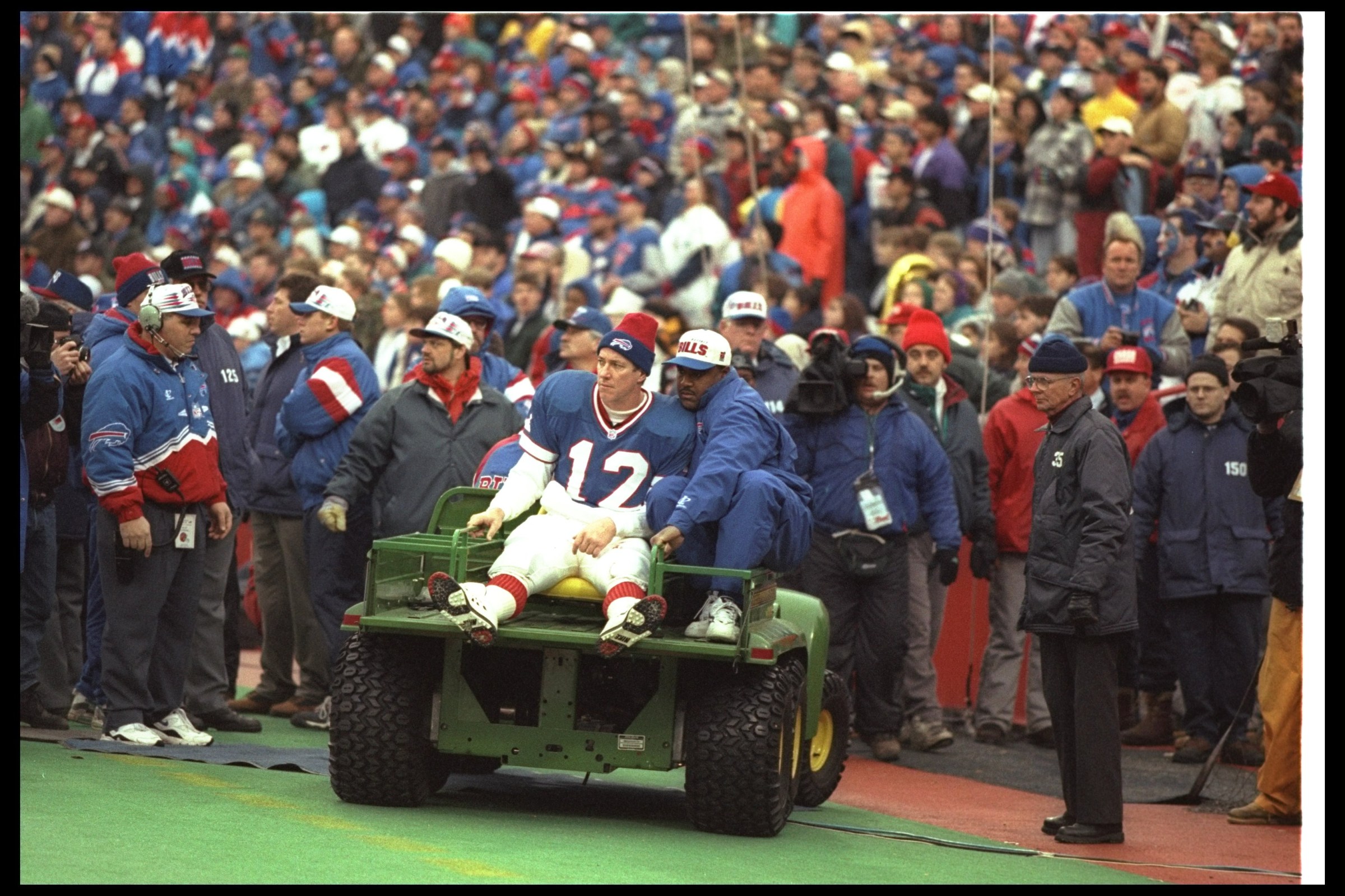 28 Dec 1996: Quarterback Jim Kelly of the Buffalo Bills is taken off the field after getting injured during a playoff game against the Jacksonville Jaguars at Rich Stadium in Orchard Park, New York. The Jaguars won the game, 30-27. Mandatory Credit: Ric
