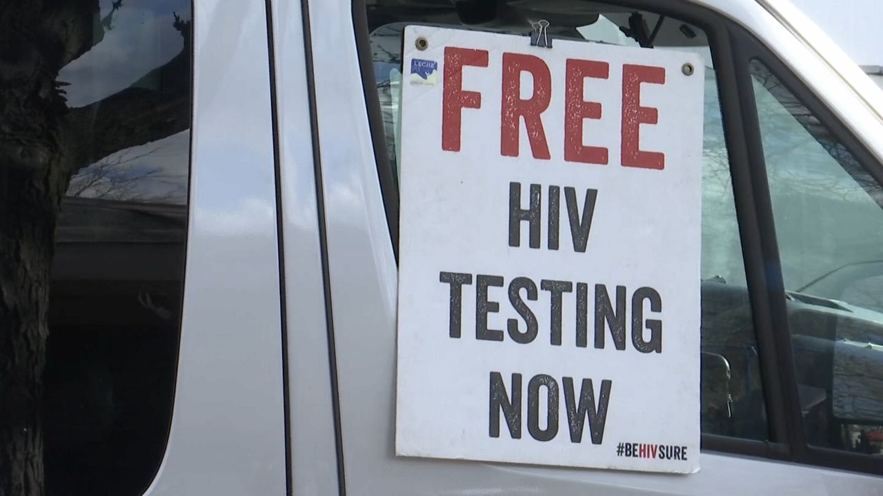 FILE — A sign for HIV testing hangs on a truck. (Spectrum News file)