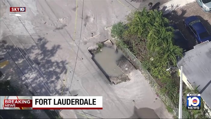 Sinkhole opens after construction vehicle hits hydrant in central Broward