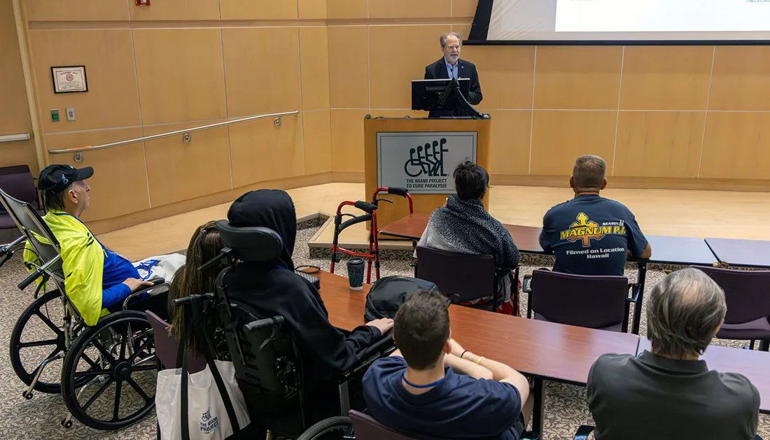 The Miami Project scientific director Dr. W. Dalton Dietrich, speaking from a podium at the group's open house