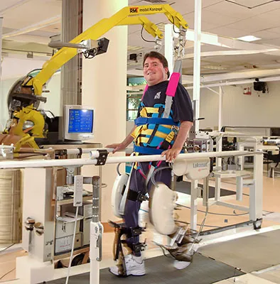 A rehabilitation patient using a device that helps with walking