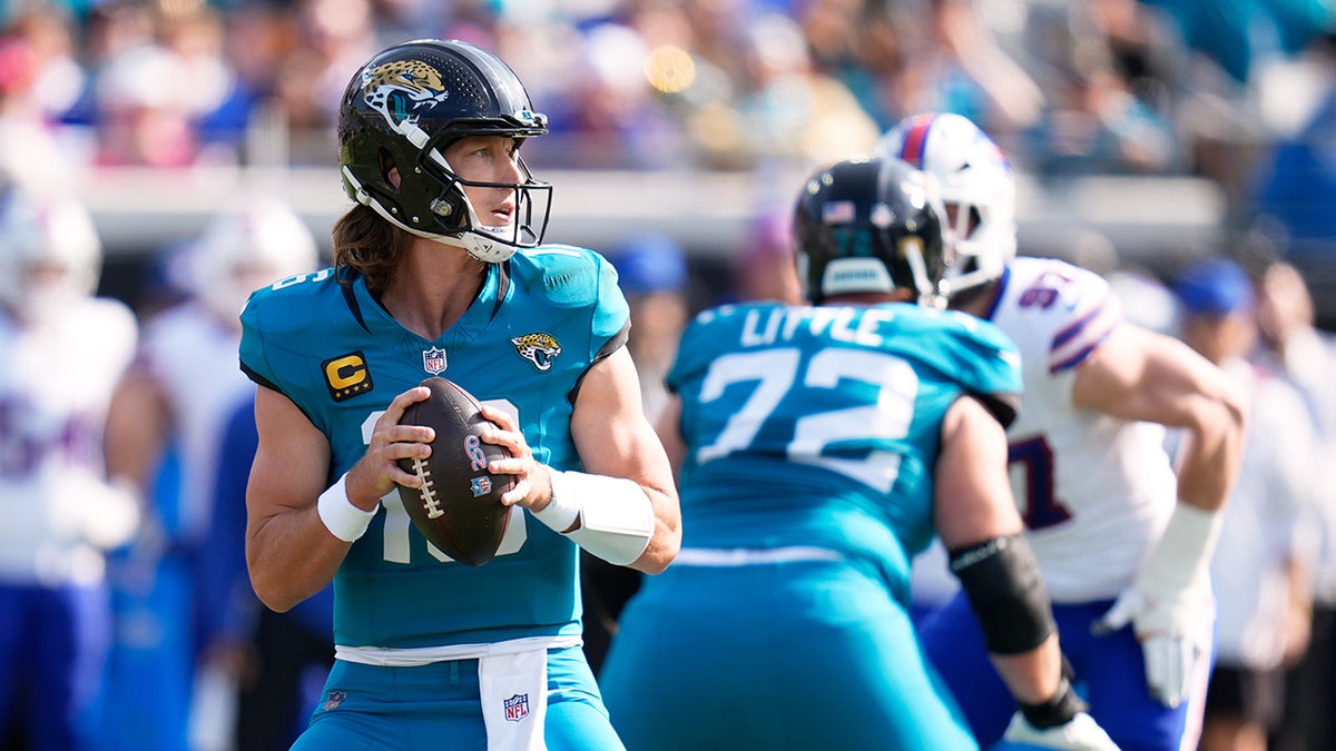 Trevor Lawrence looks down field