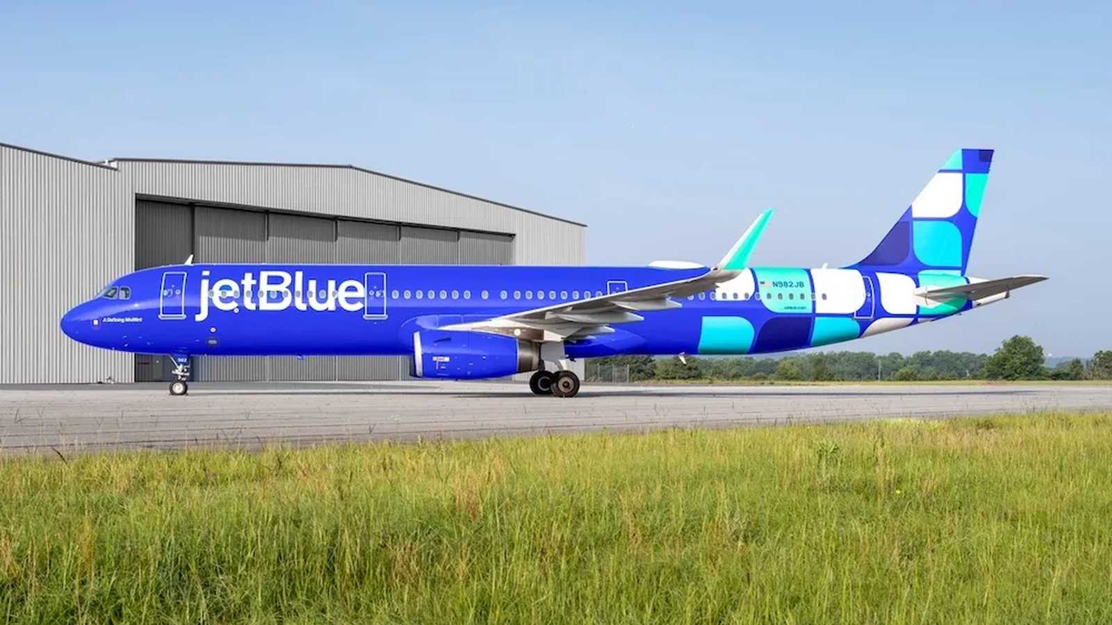 JetBlue airplane at airport gate