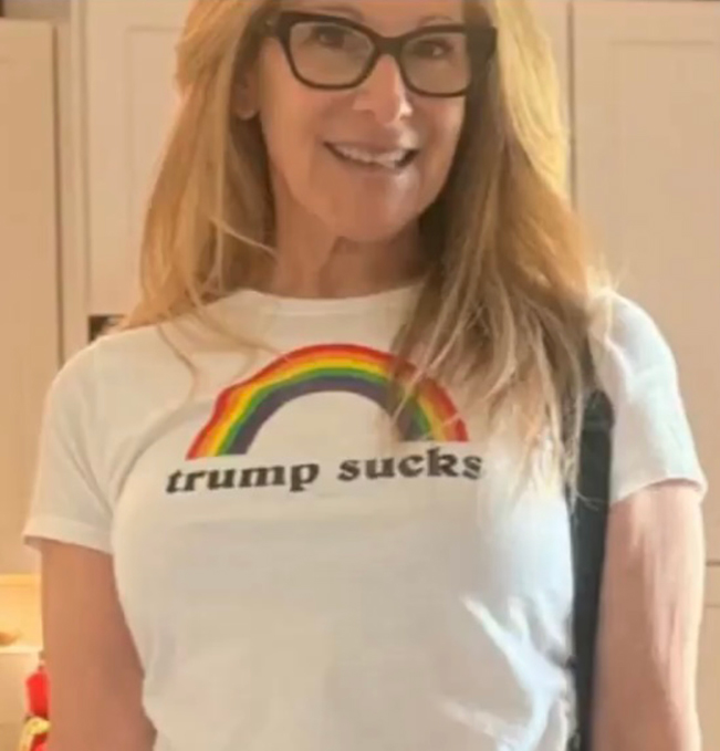 Lexi Lawler in a t-shirt that says "Trump Sucks" with a rainbow.