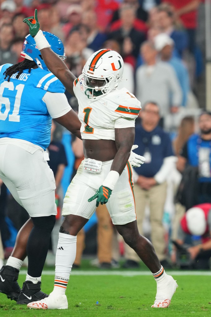Miami (FL) Hurricanes linebacker Mohamed Toure (1) reacts after a play against the Mississippi Rebels in the first half during the 2026 Fiesta Bowl and semifinal game of the College Football Playoff at State Farm Stadium. 