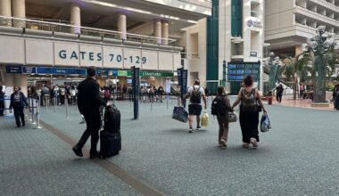 Passengers prepare to pass through security at Orlando International Airport. (Spectrum News)