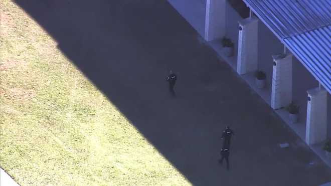 multiple orange county deputies are in a windermere neighborhood on tuesday afternoon.