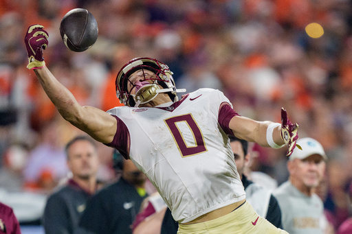 FILE - Florida State wide receiver Duce Robinson (0) tries to make a catch that falls incomplete in the second half of an NCAA college football game against Clemson, Nov. 8, 2025, in Clemson, S.C. (AP Photo/Jacob Kupferman, File)