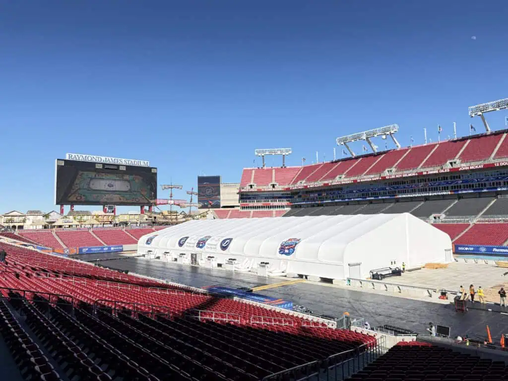 An ice rink under construction in an NFL stadium