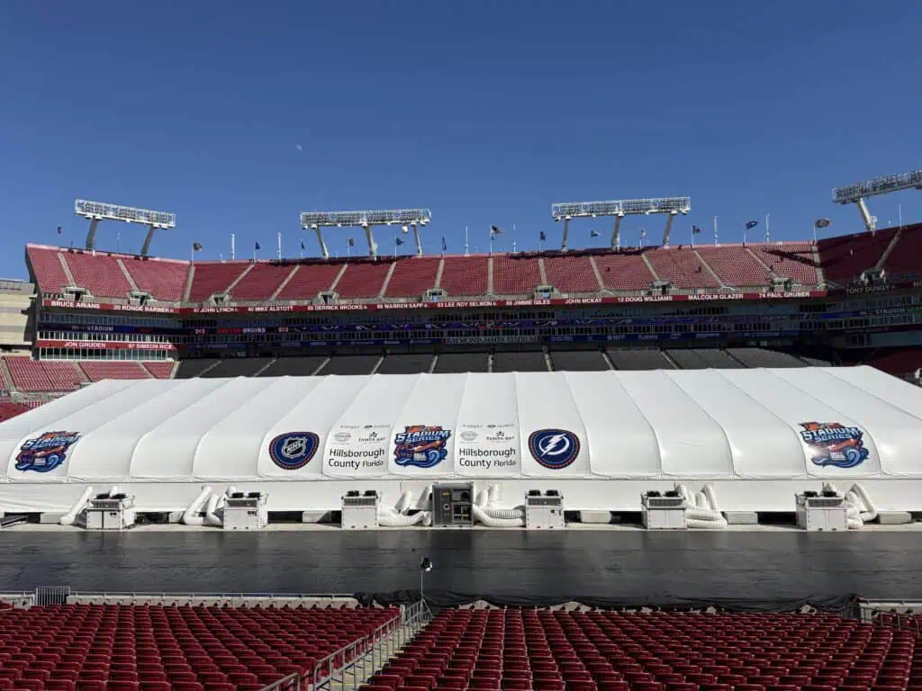 An ice rink under construction in an NFL stadium