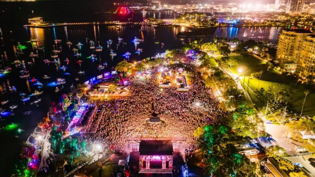 A crowded outdoor concert at night