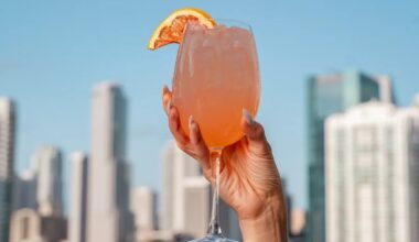 A hand holding a cocktail