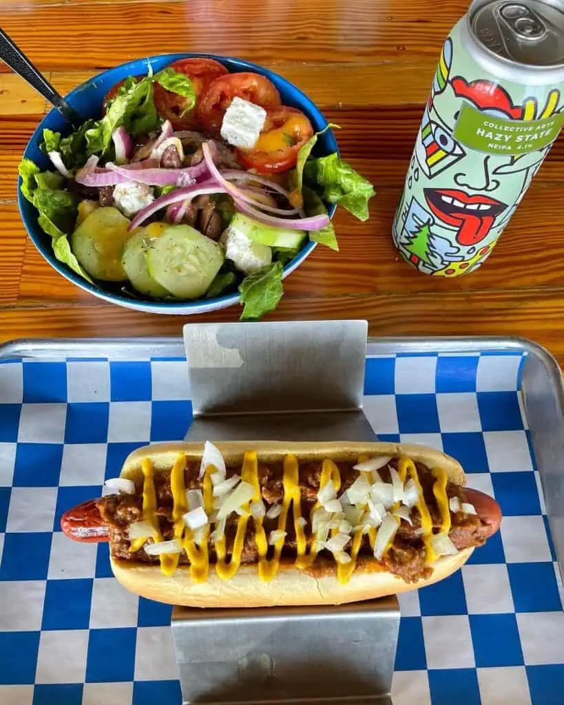 A hot dog and a salad
