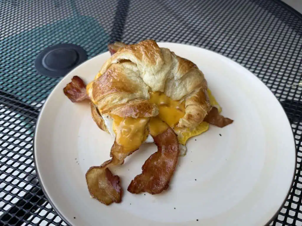 Plates of brunch food on an outdoor table