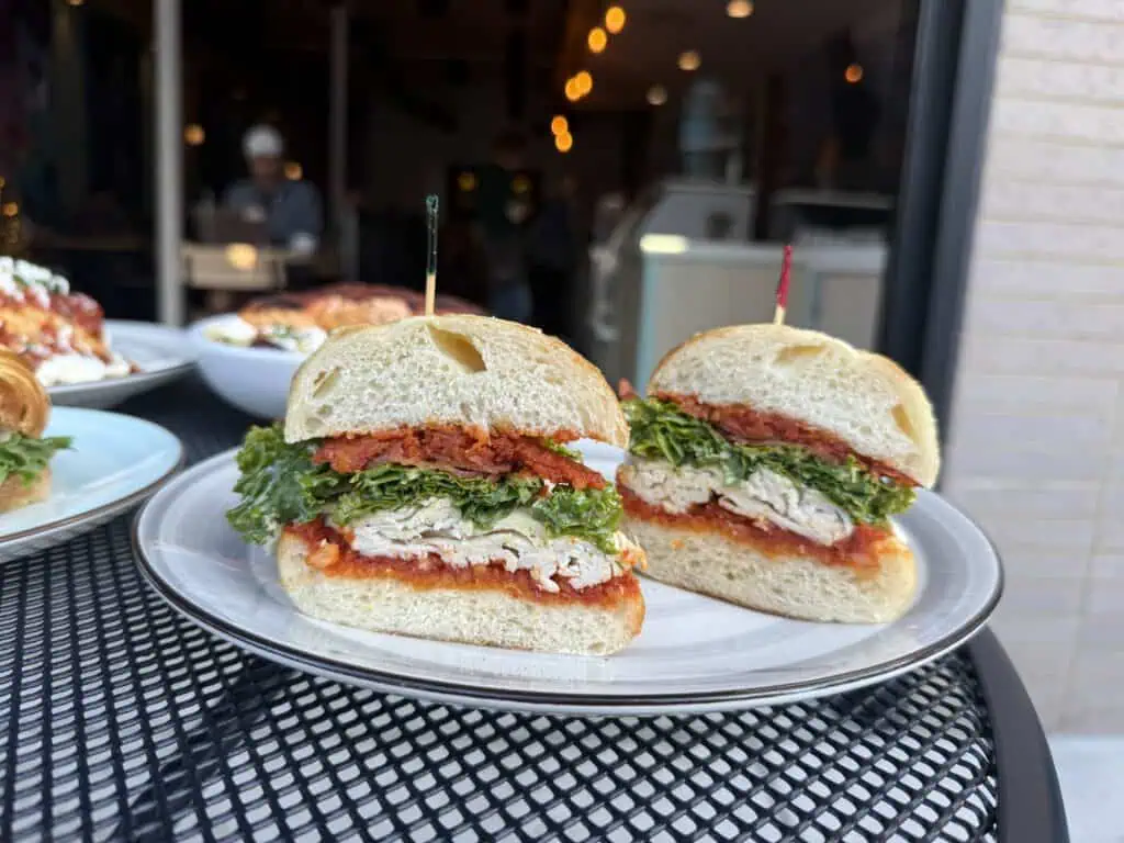 Plates of brunch food on an outdoor table