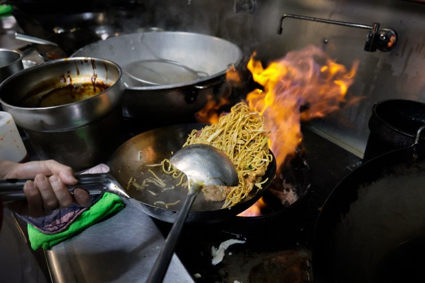 Louis Liu works the wok at Bamboo Wok in Coconut Creek, Tuesday, Jan. 6, 2026. Bamboo Wok, which has locations in Boca Raton, Boynton Beach and Coconut Creek, is the Best of South Florida Dining series winner for Chinese takeout. (Mike Stocker/South Florida Sun Sentinel)