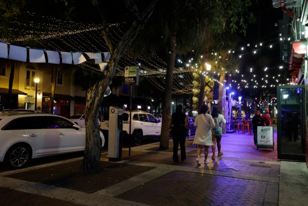 Himmarshee Village, shown Tuesday night, was the scene of a mass shooting on Dec. 28 that left five people wounded. Fort Lauderdale wants new rules in place before the arrival of Spring Break to boost safety in the city's entertainment districts. (Mike Stocker/South Florida Sun Sentinel)