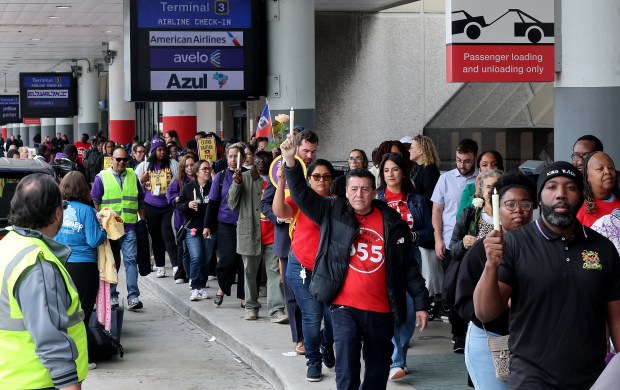 Protesters, including airport, nursing home and hotel workers, join for a press conference and candlelight vigil at Fort Lauderdale-Hollywood International Airport urging the Trump administration to extend Temporary Protected Status (TPS) for Haitian immigrants, Wednesday, Jan. 28, 2026. TPS for Haitian immigrants ends on Feb. 3, and organizers point to the U.S. government's own warnings about the dangers of traveling to Haiti. (Mike Stocker/South Florida Sun Sentinel)