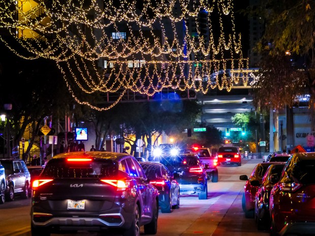 People bounce from bar to bar in historic Himmarshee Village during Spring Break in downtown Fort Lauderdale's entertainment district on Thursday, March 20, 2025. (Scott Luxor / Contributor)