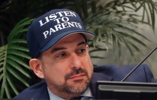 Broward County School Board member Adam Cervera listens to public comment Wednesday in Fort Lauderdale. Parents and students spoke in opposition to a money-saving measure that would move high school graduations to gymnasiums. (Joe Cavaretta/South Florida Sun Sentinel)