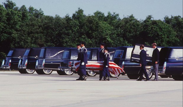 EMBARGOED FOR USE UNTIL SUNDAY, JANUARY 28 KRT NEWS STORY SLUGGED: CHALLENGER KRT PHOTOGRAPH BY RED HUBER/ORLANDO SENTINEL (KRT33-Jan. 24) Seven hearses, bearing the remains of the seven Challenger astronauts who perished when their craft blew up after launch on January 28, 1986, depart an air base in Florida en route to Dover, Delaware on April 29, 1986. (chb31914) 1996 (COLOR) (4 of 4 photos for use with this story) ORG XMIT: KRT33