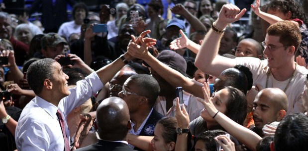 President Barack Obama greets supporters during a rally at Rollins College in Winter Park on Aug. 2, 2012. (Joe Burbank/Orlando Sentinel file)
